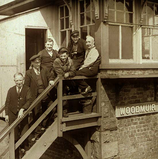 Six workers on the steps of Woodmuir Junction Signal Box in West Lothian