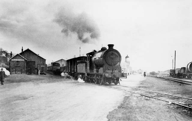 The railway line crossing West Harbour Road and approaching the entrance to Granton Harbour at Granton Square