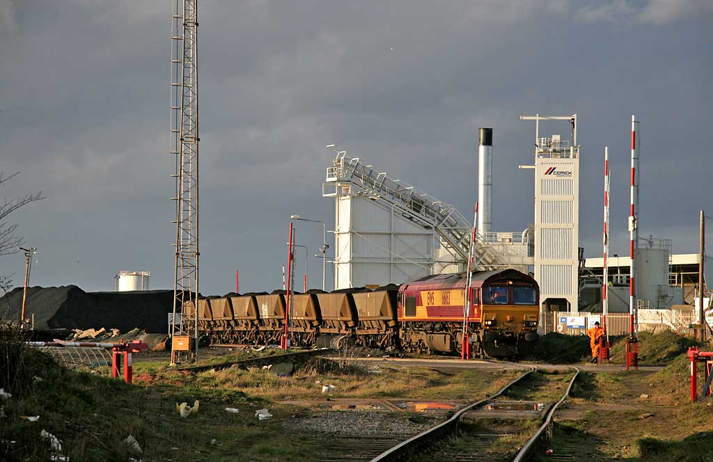 A freight train of wagons now loaded with imported coal stands beside Imperial Dock, Leith about to depart