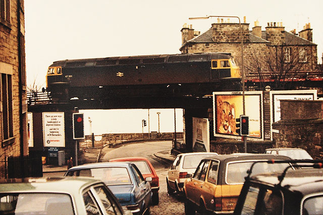 The 'track lifting' train crosses Trinity Bridge, a short distance to the wesst of Trinity Station on the line to Granton Harbour, 1986