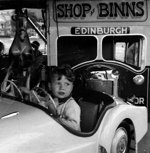 Roundabout at Burntisland with a bus advertising 'Shop at Binns - Edinburgh'  -  around 1965
