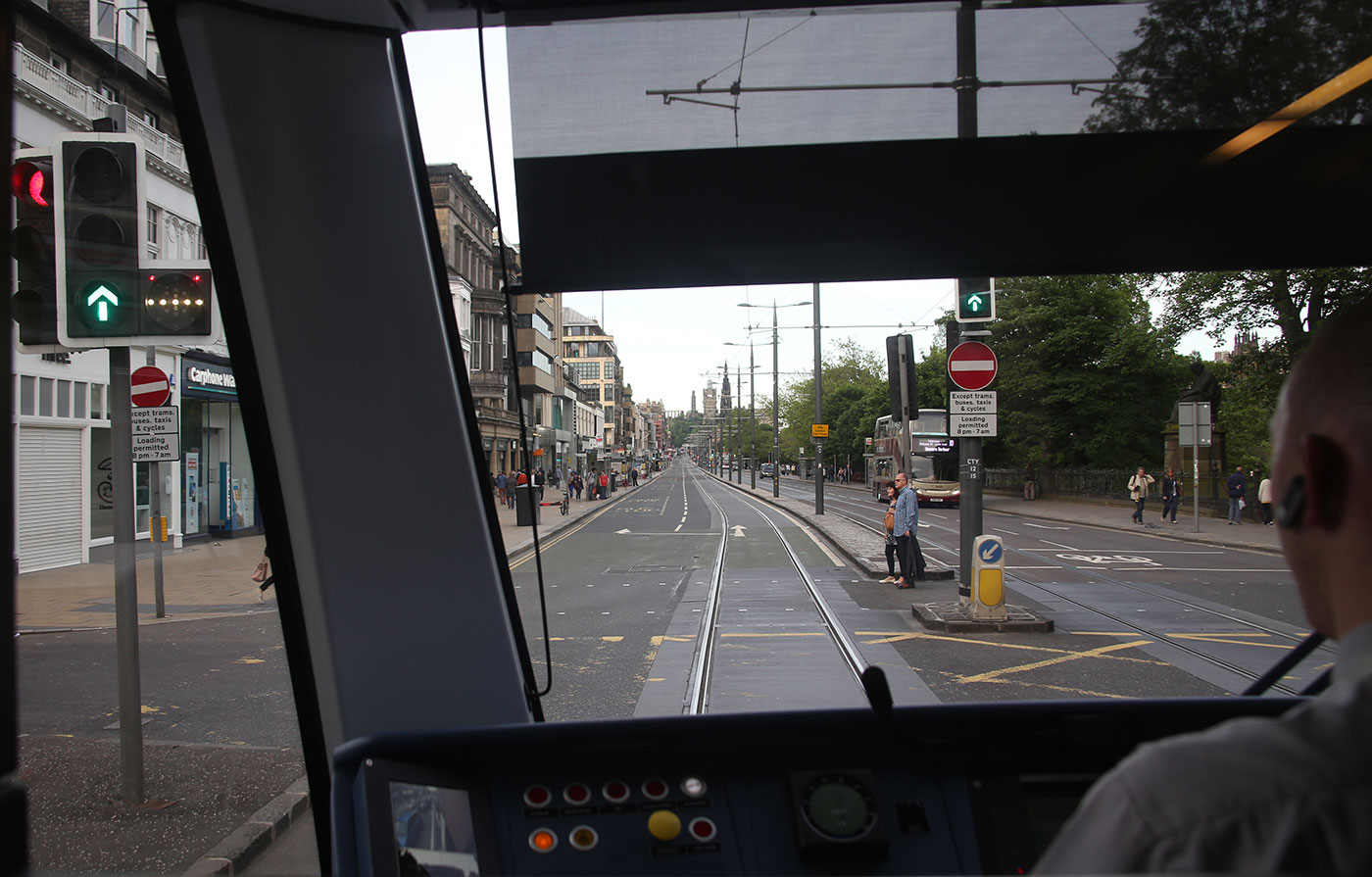 Edinburgh Tram Service  -  A tram continues to wait at the lights before entering Princes Street on its journey to York PlacePrinces Street  -  June 2014