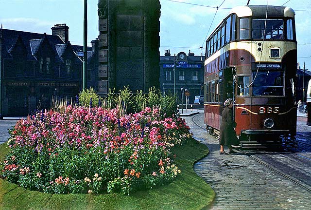 A tram passes Haymarket Station and Clock  -  1950s