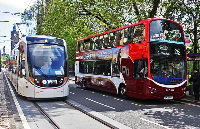 Tram and Bus in Princes Street, mid-March 2014.  The bus is in the new branded livery for Route 26