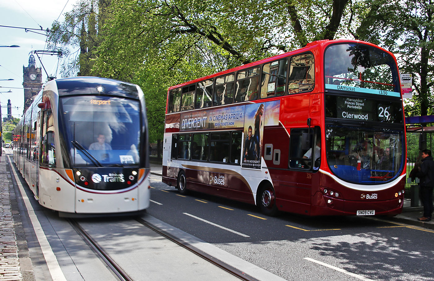 Tram and Bus in Princes Street, mid-March 2014.  The bus is in the branded  livery for Route 22