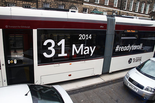 Tram in York Place in early-March 2014, announcing the date when the Edinburgh tram service will commence