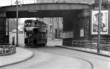 A tram passes under Trinity Bridge in the 1950s.