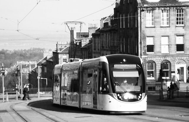 A new tram turns from York Place into North St Andrew Street, shortly before trhe tram service went live on May 31, 2014