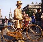 Street Entertainment  -  Golden Cycle Man with Cycle in the Royal Mile during the Edinburgh Festival  -  August 2003