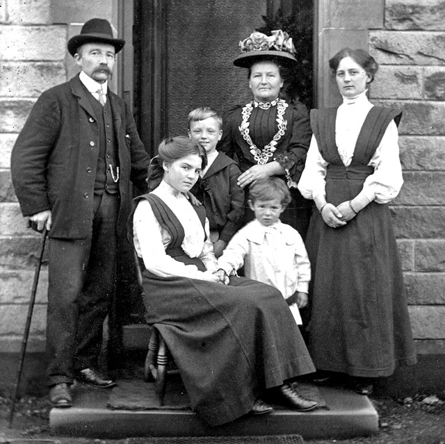 The first family at Kirkgate, Liberton on the doorstep of their house, around 1908