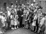 Boxer, Jackie Brown is welcomed home to Lyne Street with his Empire Games Gold Medal, July 1958