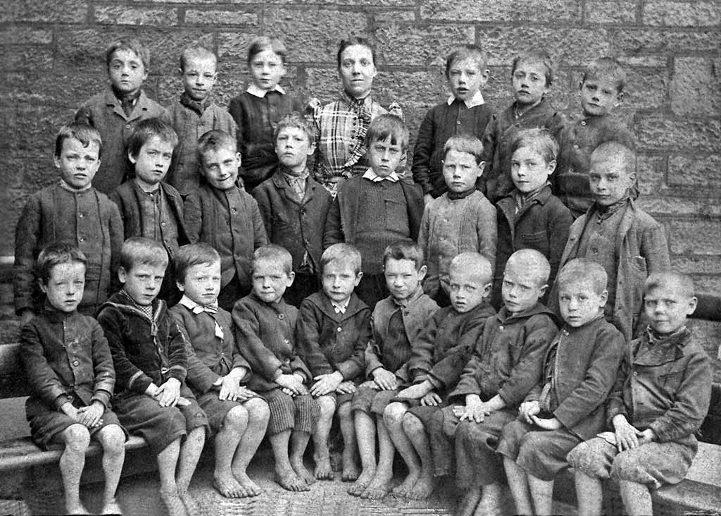 A group of barefoot children at Milton Street School, around 1895