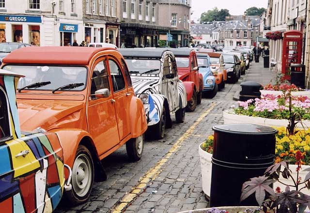 Citroen 2CVs in the centre of Kelso in the Scottish Borders  -  during the World 2CV Meeting held at Kelso, July 2005
