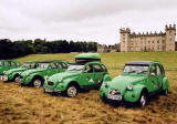 Citroen 2CVs in the grounds of Floors Castle, Kelso in the Scottish Borders  -  during the World 2CV Meeting held at Kelso, July 2005