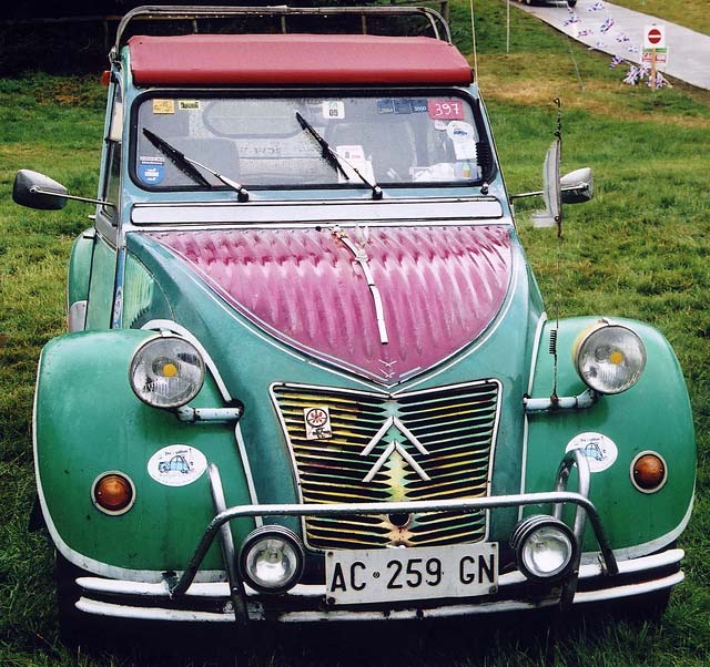 A Citroen 2CV in the grounds of Floors Castle,  Kelso, in the Scottish Borders  -  during the World 2CV Meeting held at Kelso, July 2005