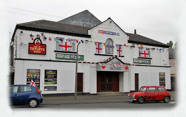 Bradford, Laisterdyke  -  Lyceum House, decorated in support of the English team in the Football World Cup being held in South Africa, June 2010
