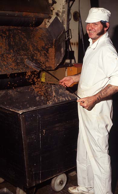 Duncan's Chocolate Factory  -  Beaverhall Road, Edinburgh,  1991  -  A worker shovelling chocolate