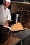 Duncan's Chocolate Factory  -  Beaverhall Road, Edinburgh,  1991  -  A worker shovelling chocolate