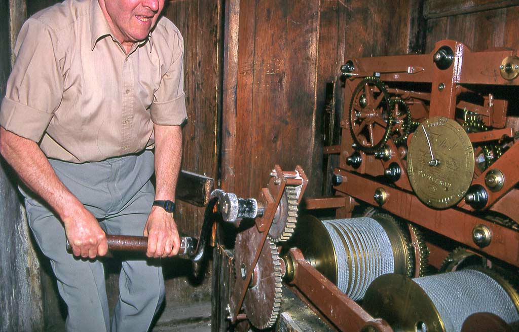 The clockwinder, winding the clock at St Andrew's & St George's Church