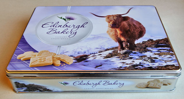 A tin for shortbread, sold at Christmas 2011 by Edinburgh Bakery, featuring my photo of a highland cow near Crianlarich