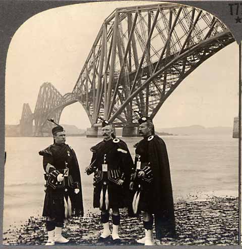 Enlargement from stereo photographs by Keystone View Company  -  The Forth Rail Bridge- with three pipers at South Queensferry