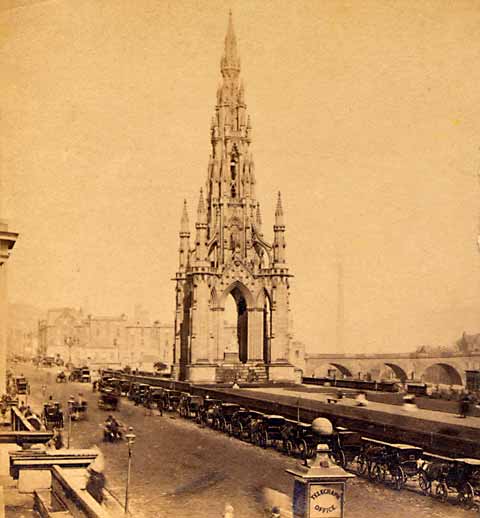 Enlargement of GW Wilson stereo card - The Scott Monument and a line of coaches in Princes Street
