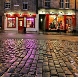 Looking from the foot of West Bow across the cobbles to the shops on the south side of the Grassmarket