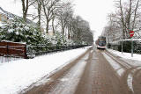 Looking west along Greenbank Drive, as a bus approaches, near the start of its journey to Trinity -  December 2009