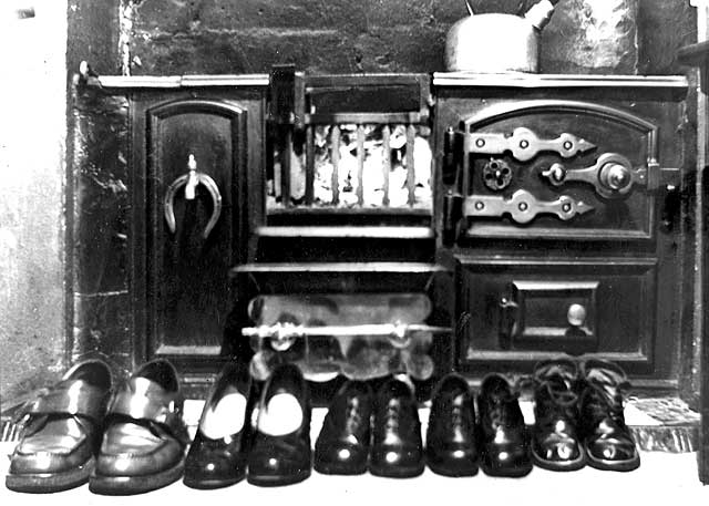 Shoes and Boots in front of the Fireplace at Wullie Croal's house, 6 Heriot Mount, Edinburgh