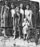 Six girls and a dog near the Howe Street end of Jamaica Street, around 1952