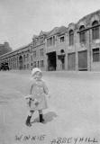 Winnie Butler standing in London Road, 1921