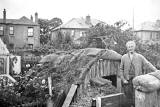 Grandfather Williamson standing outside an Anderson Shelter in a garden at Orchard Road, Edinburhgh