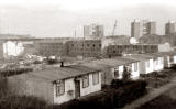 Oxgangs Avenue  -  Prefabs in the foreground and high-rise flats in the background.