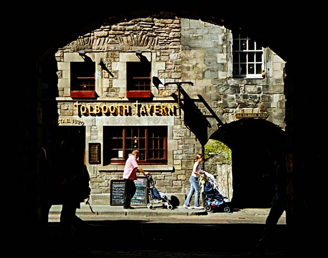 Looking through Sugarhouse Close across the Edinburgh Royal Mile towards Tolbooth Tavern and Old Tolbooth Wynd