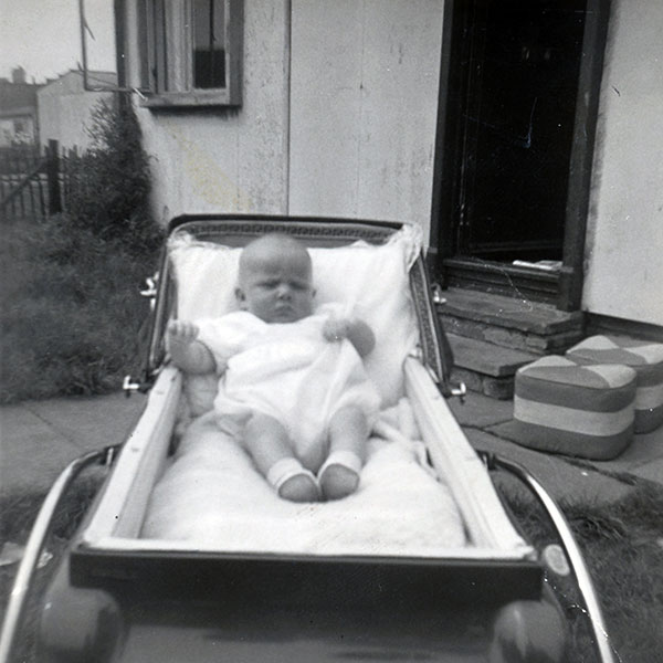 Francis Goodwin in his pram outside his prefab at No.8 West Pilton Terrace,  March 1964