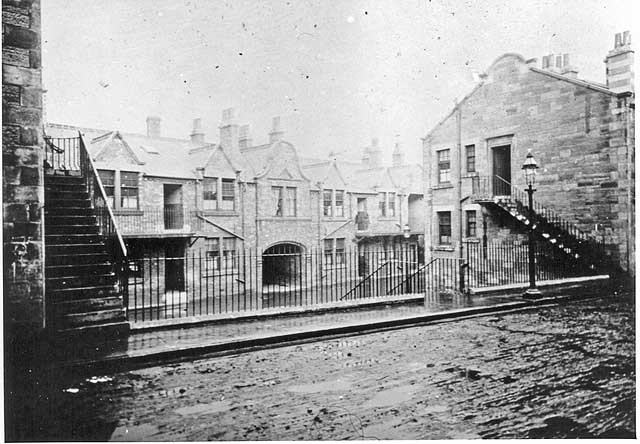 Where and when was this photograph of railings, stairs and an arch taken?